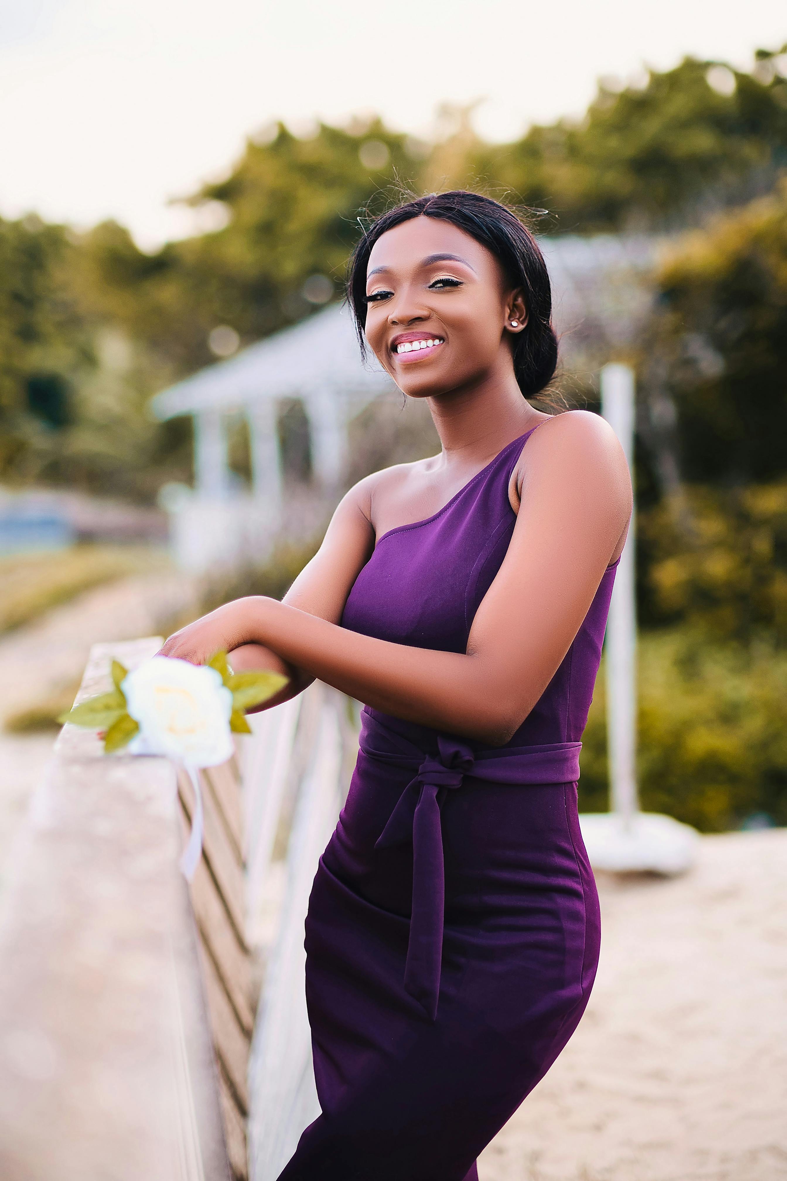 A girl in a purple bridesmaid dress