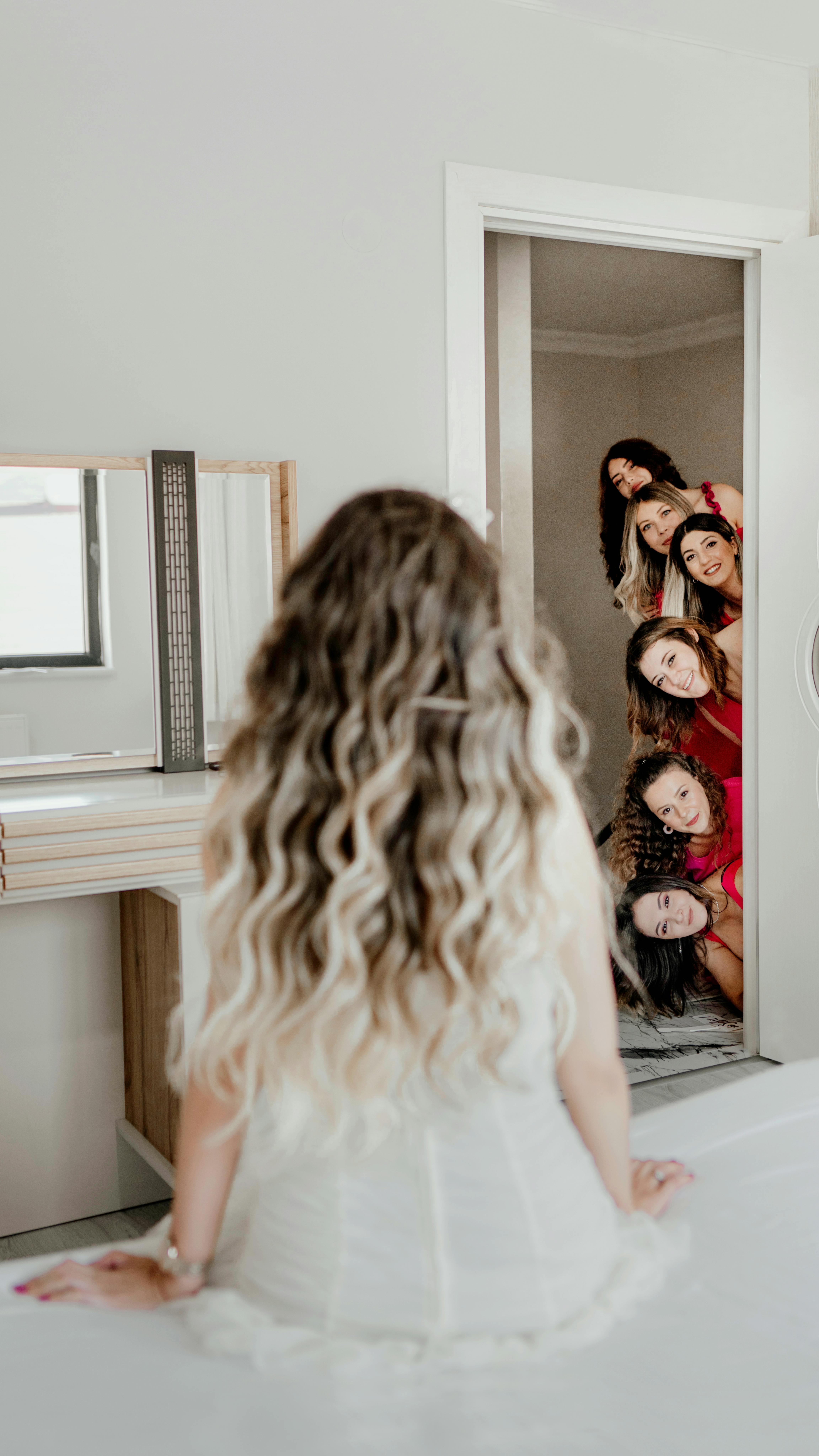 Bridesmaids in red and bride